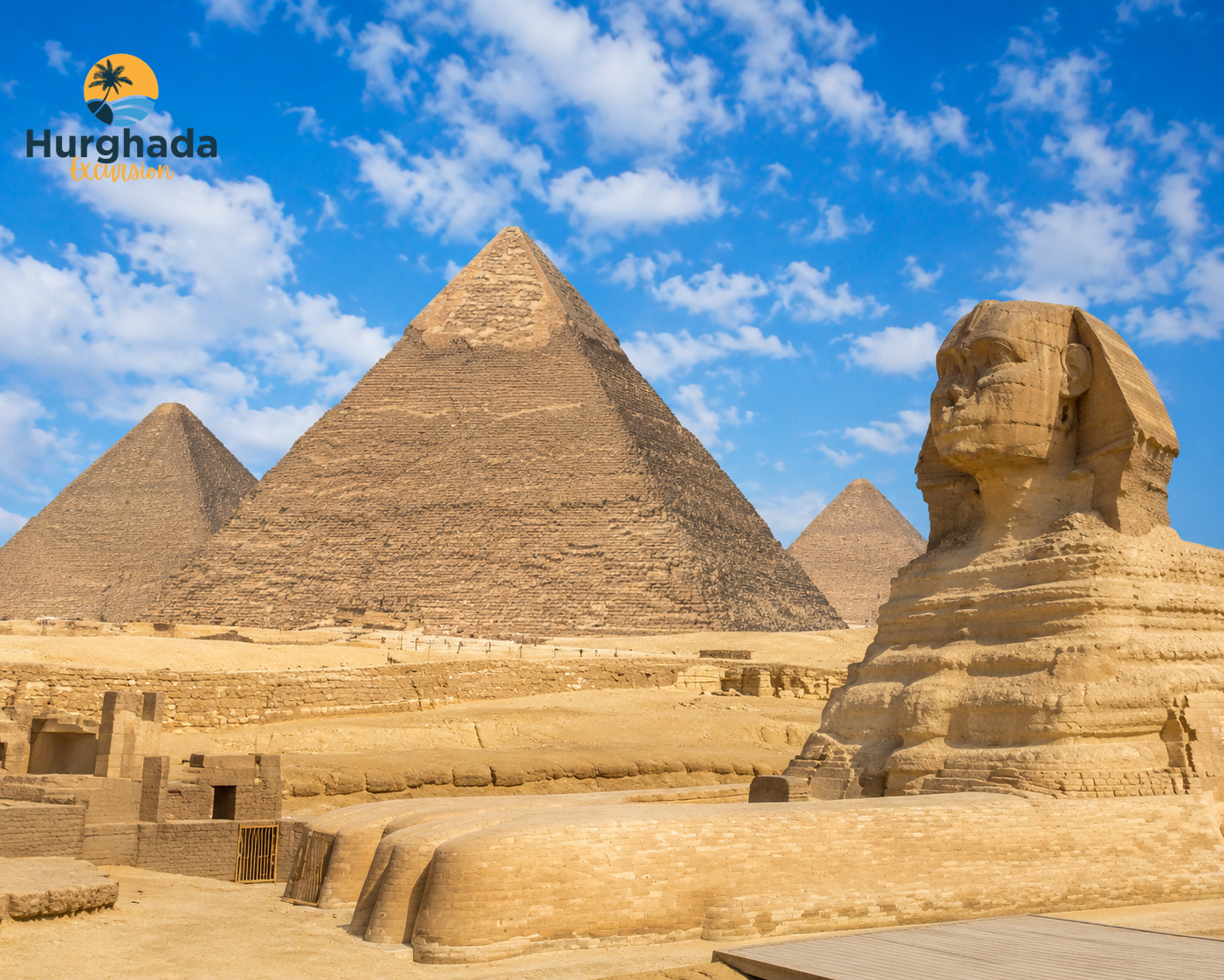 The Great Pyramids of Giza and the Sphinx Under a Blue Sky